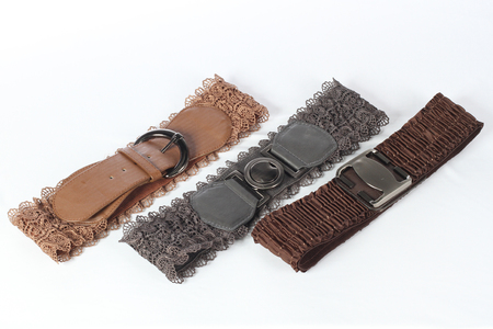 three womans belt on white backgroundの写真素材
