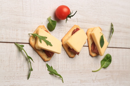 Slices of cheese arranged in a specific wayの写真素材