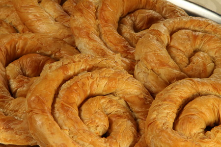 Traditional Bulgarian homemade spiral made banitsa, may pieces.の写真素材