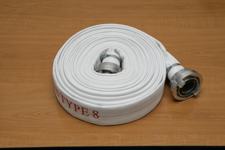 A shot of a white fire hydrant hoseの写真素材