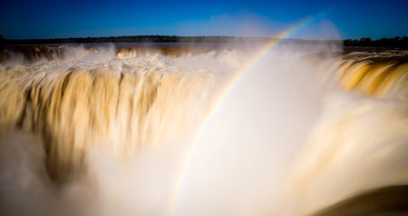 Long-exposure from the top of Iguazu Falls in Argentina with rainbowの写真素材