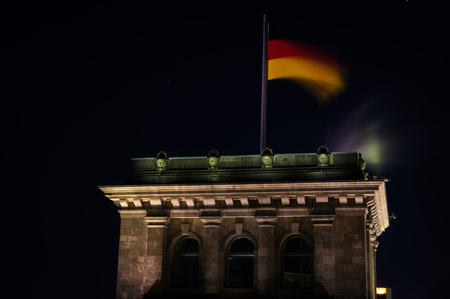 German Flag at Night on Reichstag Building in Berlin, Germanyの写真素材