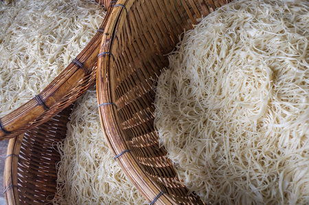 Asian dried gelatin noodles food in wooden baskets close upの写真素材