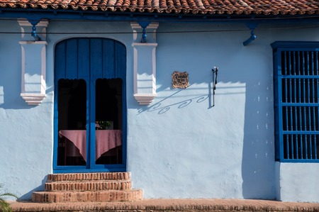 Door and window facade at colonial Cuban houseの写真素材