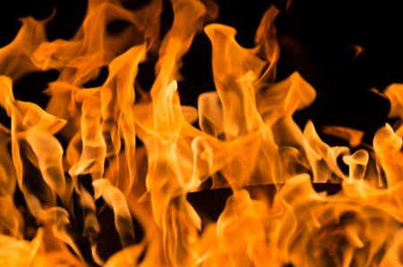 A close-up of intense orange flames in a fire