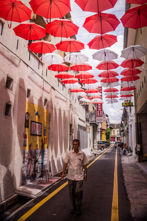 Ipoh, Malaysia on October 20, 2016: Man walking along Market laneのeditorial素材