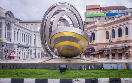 Penang, Malaysia on October 23, 2016: Modern fountain in a roundabout with colonial architecture in the backgroundのeditorial素材