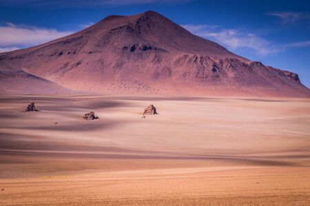 Volcanic Landscape in the Altiplano in Southern Bolivia near the border to Chile: Within a few hundred kilometres, salt lakes, snow-capped volcanoes and volcanic hot springs can be found.の写真素材