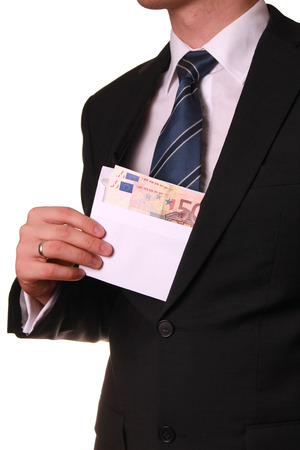 young businessman taking bribeの写真素材