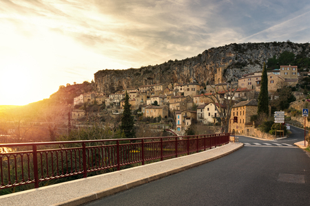 Beautiful sunset in Peyre which is  one of the most beautiful villages in France and that is illuminated by the sun in golden, orange and red light.の写真素材