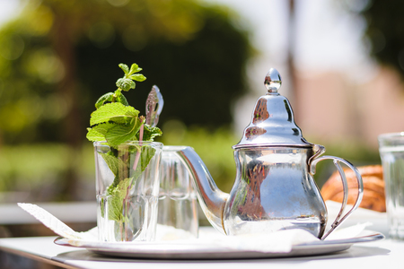 Teapot and glass with mint leaves, Moroccoの写真素材