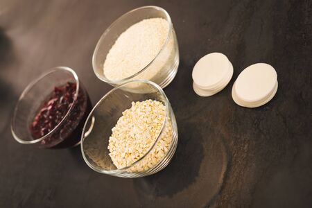Ingredients for cranberry macaroons: cranberry cashew hazelnut and wafer.の写真素材
