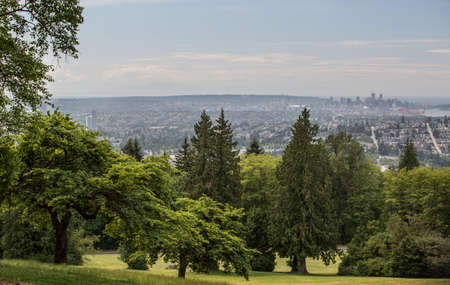 The urban view to Vancouver from Burnaby Mountain daytime in summer in BC, Canadaの写真素材