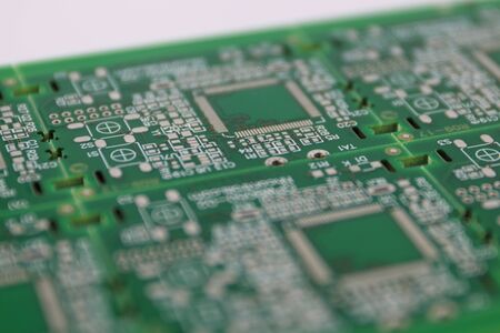 Multiplied printed circuit boards PCB isolated on the white background. PCB assembly. Close-up viewの写真素材
