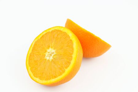 Fresh orange halves isolated on white background. Fresh sliced orange separated on white backgroundの写真素材