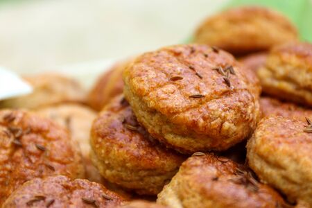 Homemade Pork Rind Biscuits with cumin seeds. Baked to a goldsmith. Salty cookies made of ground pork cracklings and sprinkled with cumin. Traditional Slovak and Czech food.の写真素材