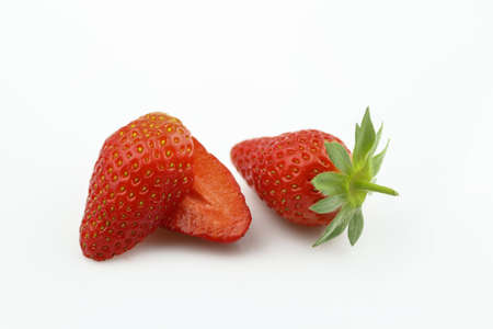 Strawberry isolated. Strawberries isolate. Whole, half, cut strawberry on white. Strawberries isolate. Side view organic strawberries. Full depth of field.の写真素材