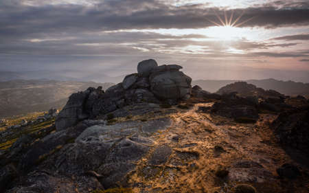 Mountain landscape illuminated by the first rays of sun, Serra da Estrela Natural Park.の写真素材