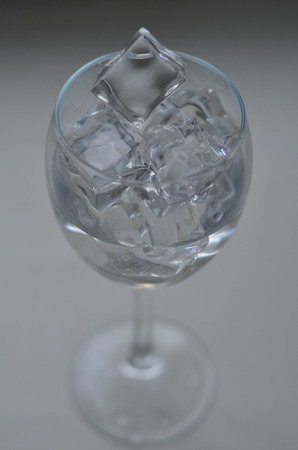 Glass of water with ice isolated on the white backgroundの写真素材