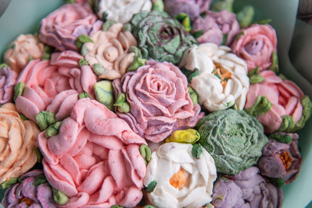 Close up bouquet of sweet sugar marshmallow rose flowers. Edible flowers, small business, hobby. Delicious holiday gift. Natural organic baking sugarless. Tasty gift for holidays. Mothers dayの写真素材