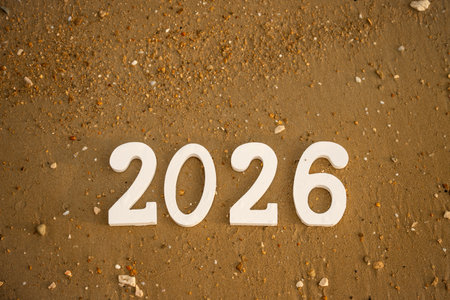 White wooden numbers 2026 are placed on a sandy beach representing the upcoming new year, evoking feelings of excitement and anticipation for future opportunities and adventuresの写真素材