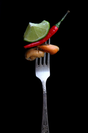 Food photo as art. Lime, chili and mussels.の写真素材