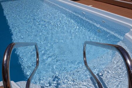 Swimming pool with stair close upの写真素材