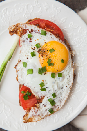 Toast with tomato and egg. Breakfast.の写真素材