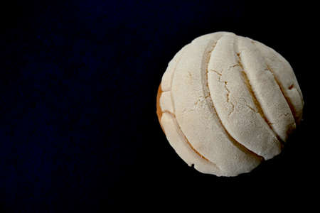 Closeup of delicious homemade vanilla Mexican shell on dark background with copy spaceの写真素材