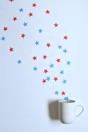 white mug with handle with white, blue, red stars, American flag, on white background with copy spaceの写真素材