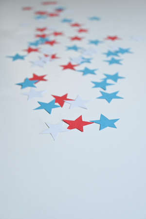 Background of five pointed stars the color of the usa flag, red, blue, white, with copy spaceの写真素材
