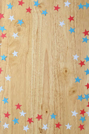 Natural pine wood background with frame in the colors of the American flag, white, red and blue, with copy spaceの写真素材