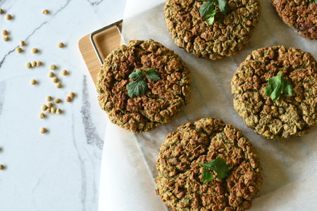 Overhead shot of lentil burgers on marble background, with copy spaceの写真素材
