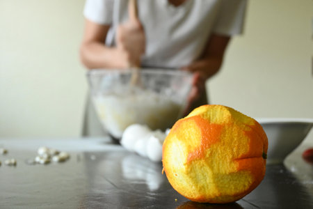 Out-of-focus portrait of woman preparing doughの写真素材