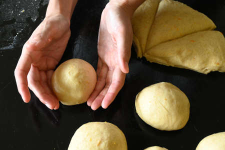 overhead woman bowling raw doughの写真素材