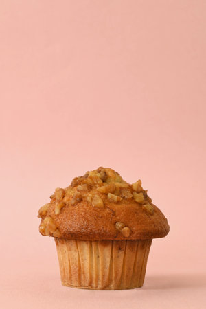 Vertical plane of pecan cupcake on pink background, copy spaceの写真素材