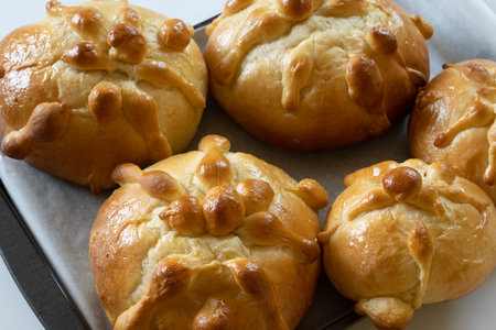 Close-up of several homemade Mexican pan de muerto, selective focus, dia de muertos concept