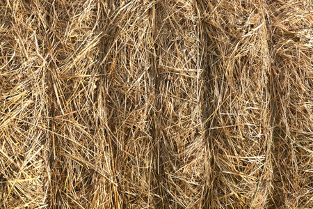 full frame of straw roll, background with copy space