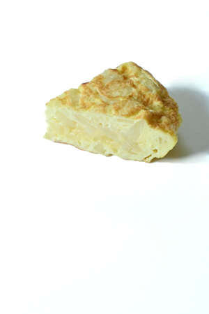A piece of spanish omelet over white background, copy space, concept of spanish foodの写真素材