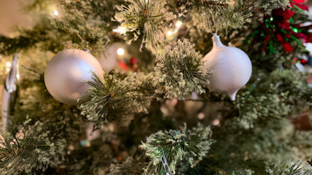 Christmas tree with ornaments on the background of a garland