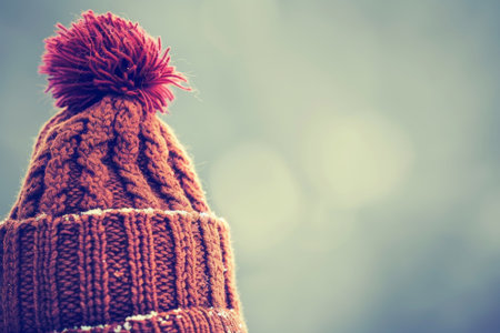 Isolated winter hat on seamless background with knitted textures and soft shadows in neutral tonesの素材