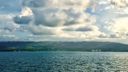 Beautiful view of the sea, mountains and the sky with cloudsの写真素材