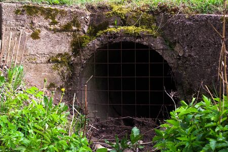 grate at the entrance to the drainpipe,の写真素材