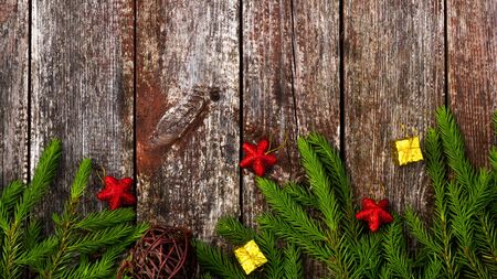 Christmas background for greeting card. Fir branches on wooden background.の写真素材