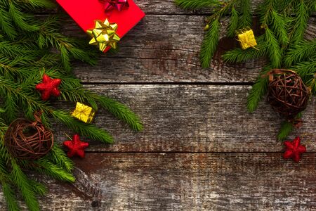 Christmas background for greeting card. Fir branches on wooden background.の写真素材
