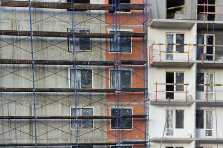 building under construction in scaffoldingの写真素材