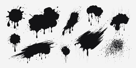 Ink drops. Paint splashes, grunge liquid drops splash. Black liquid stains with scattered drops. Isolated spray elements on a white background. Blobs of different shapes. Abstract vector textures.のイラスト素材