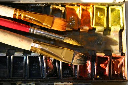 Box of old colorful watercolors,  brushes and paletteの写真素材