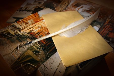 Letter with feather-pen on background of italian photosの写真素材