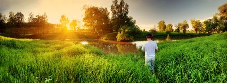 River and fisherman on sunsetの写真素材